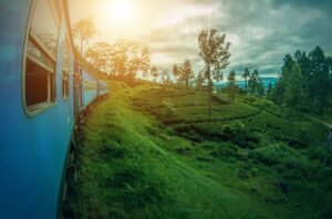 sunset over a blue train in Sri Lanka